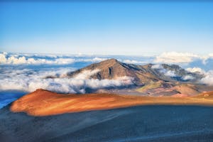 Peak of Haleakala Crater witih blue sky and white clouds in the sky