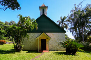Charles Lindbergh Grave a large lawn in front of a house, Facade of the Palapala Ho‘omau Congregational Church in Kipahulu on Hana Highway, east of Maui island in Hawaii, United States