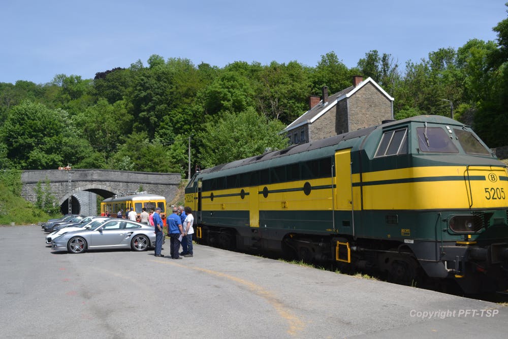 a train is parked on the side of a road