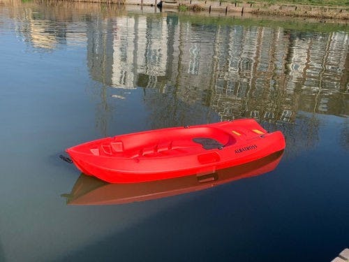 a small boat in a body of water