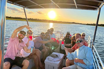 friends enjoying a sunset cruise in wrightsville beach
