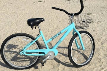 a bicycle parked on a beach