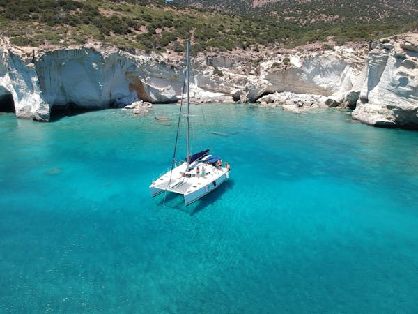 Catamaran in Kleftiko Milos for snorkelling in crystal clear waters