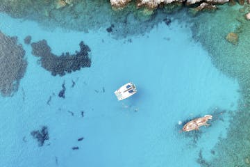 A drone photo of our catamaran in Galazia Nera in Poliegos