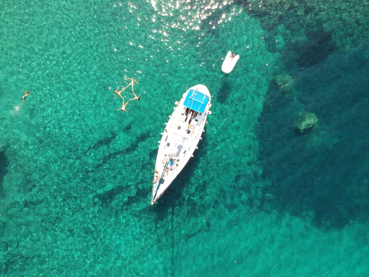 Drone photograph of our sailing boats in Kalogries, West Milos