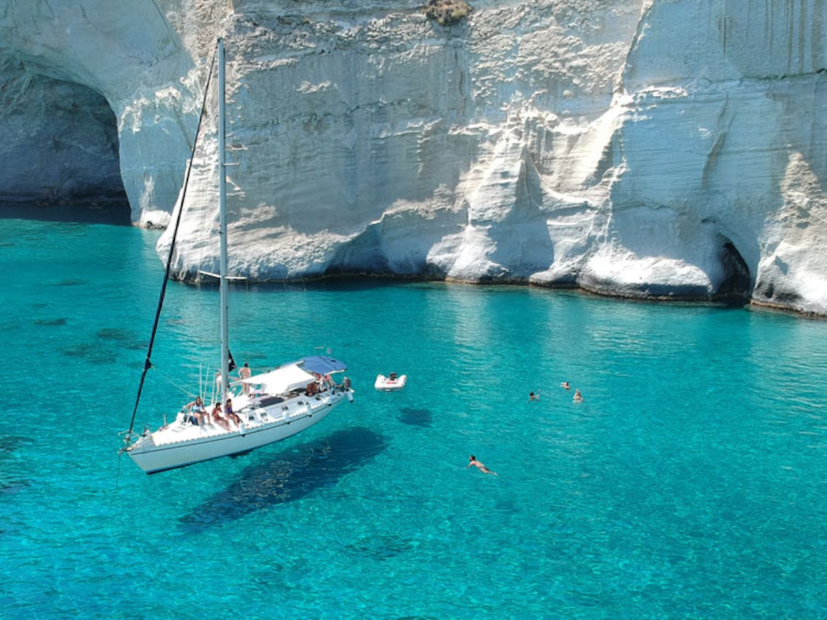 One of our sailing boats anchored in Kleftiko in crystal clear waters