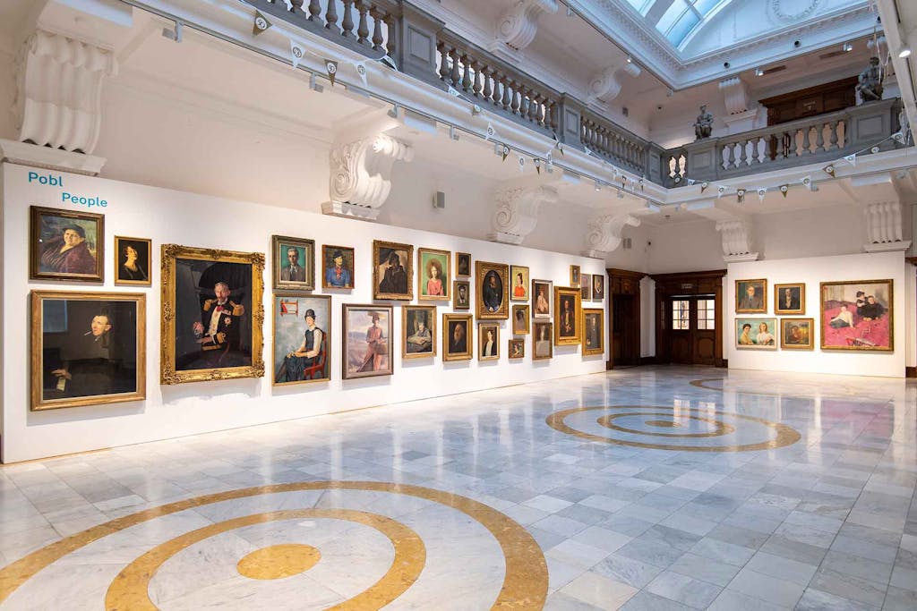 Inside the Glynn Vivian art gallery with paintings on the walls