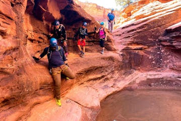 a group of people in a canyon