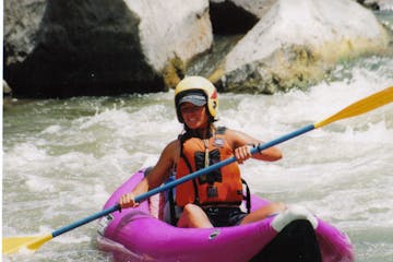 a person in a raft on the water