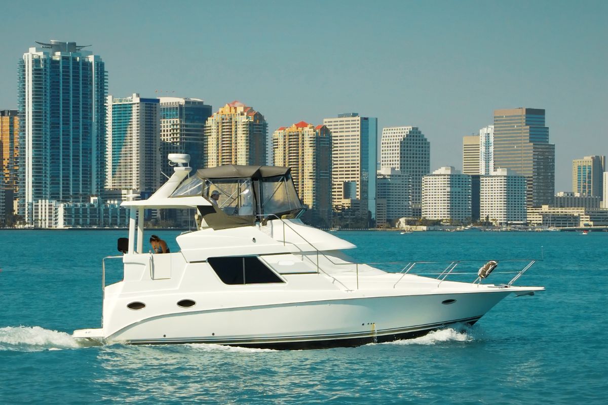 luxury boat charter with miami skyline in background