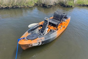 a small Electric kayak in a body of water