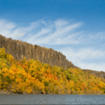 Hudson River and the Palisade Cliffs during a fall foliage boat tour from NYC