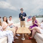 friends on boat rides around nyc with champagne