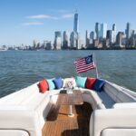 new york yacht rental with colorful pillows and the city skyline