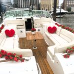 beautiful yacht for a proposal in Manhattan Chelsea Piers with red rose bouquet