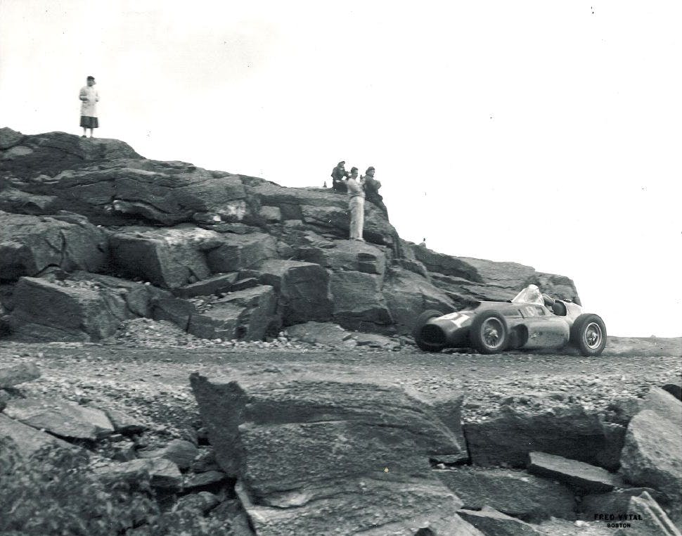a group of people on a rocky hill