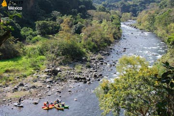 a group of people traveling down a river