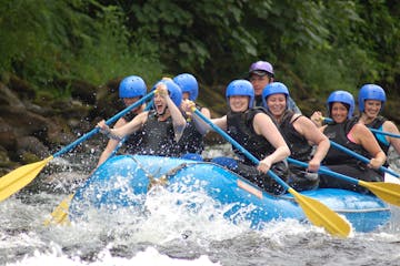 a group of people riding on a raft
