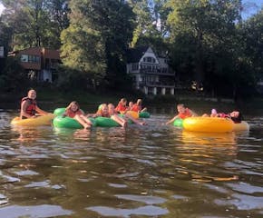 a group of people on a raft in a pool of water