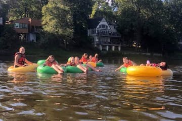 a group of people on a raft in a pool of water