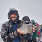 a man holding a fish