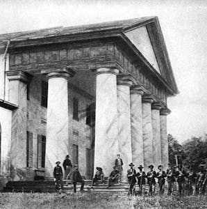 a group of people standing in front of a building