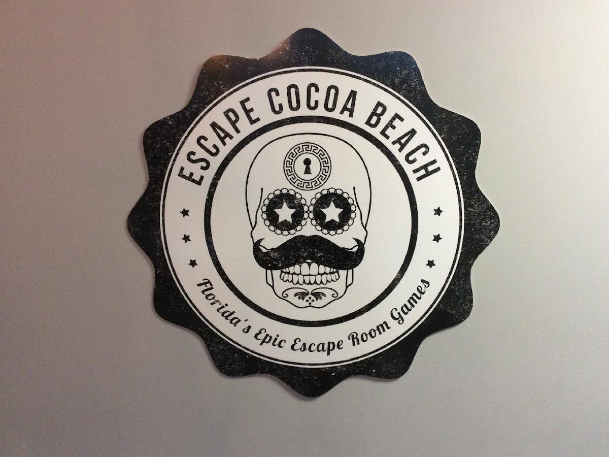escape cocoa beach logo, skull with mustache