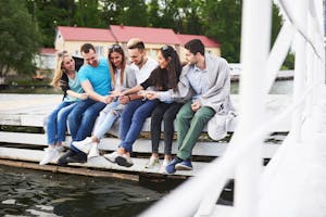 a group of people sitting on a boat