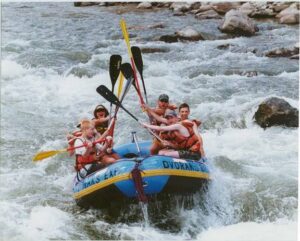 a group of people riding skis on a body of water