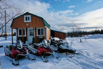 a group of parked motorcycles sitting on the snow