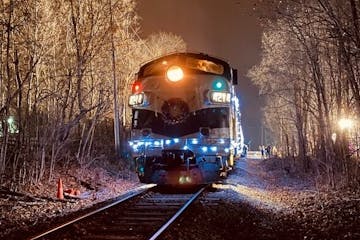 a train on the tracks at night