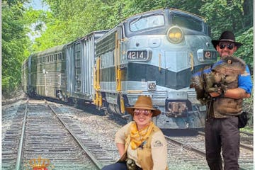 a person standing next to a train
