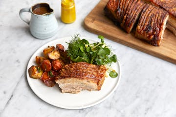 a plate of pork belly