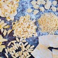 a close up of various types of fresh pasta