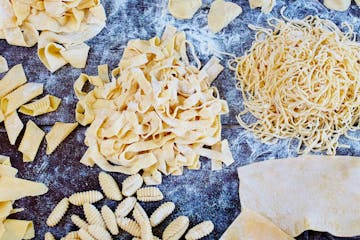 a close up of various types of fresh pasta