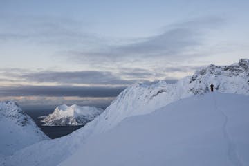 a person skiing in mountains