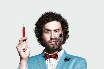 T.J. Miller wearing a suit and tie
