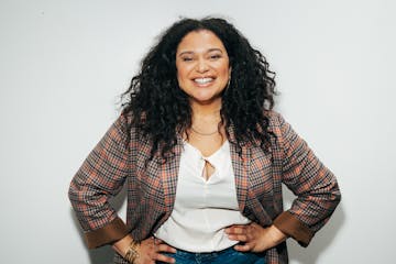 Michelle Buteau smiling for the camera