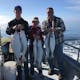 Family holding up halibut catches on fishing trip