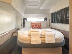 a bedroom with a bed and luggage