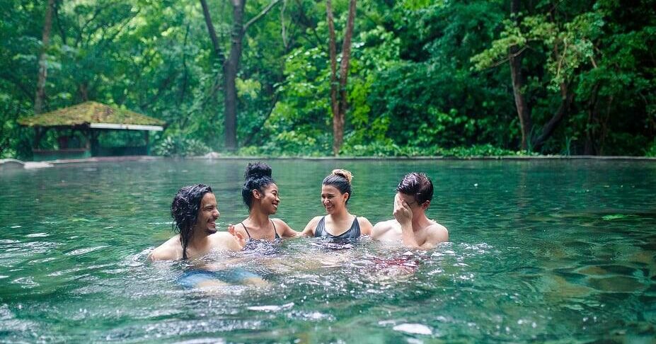 a group of people swimming in the water