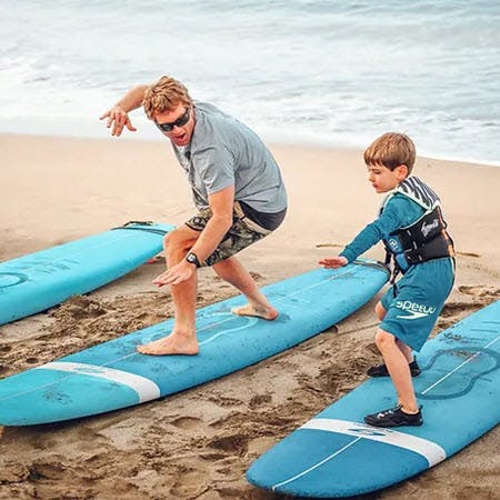 Kevin Providing Surf Lesson To Kid