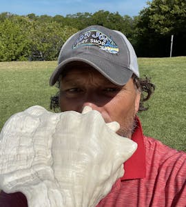 Craig holding Conch shell