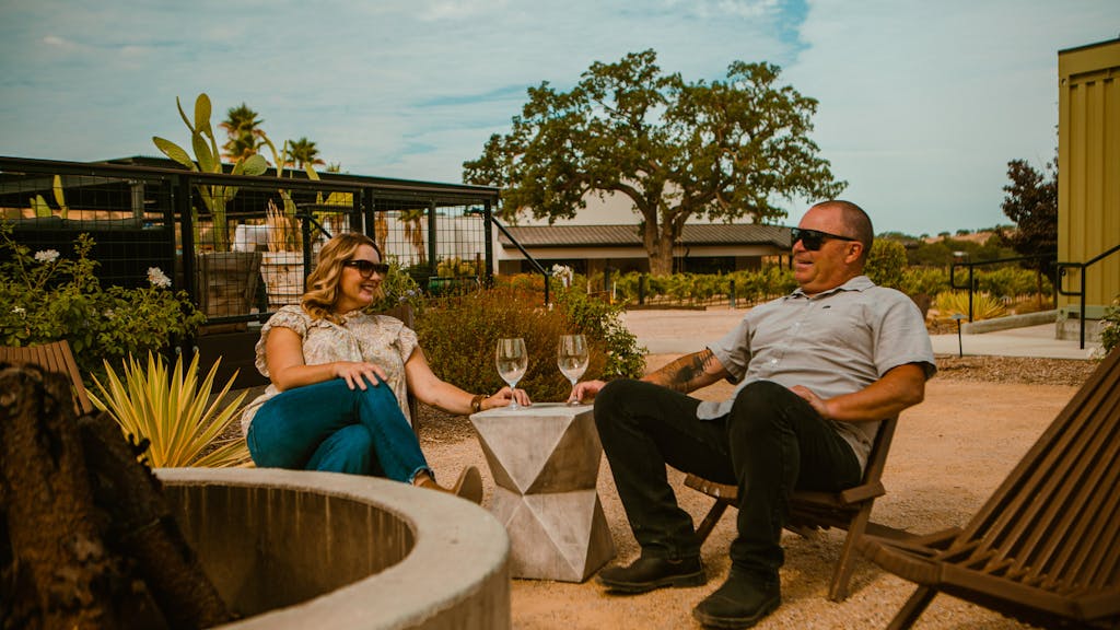 a couple enjoying wine tasting in Paso Robles