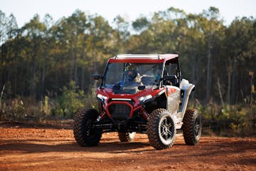 A 2024 Polaris RZR XP 1000 Ultimate on a Trail stopped