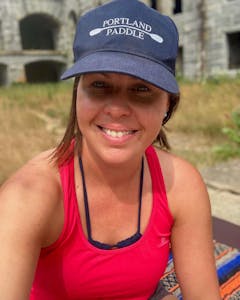 a yoga instructor smiling for the camera at Fort Gorges