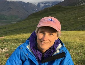 Janet hiking in Denali NP with MITA hat on