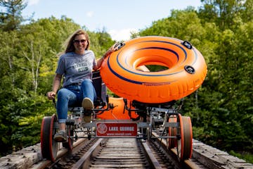 a person riding a rail bike posing for the camera