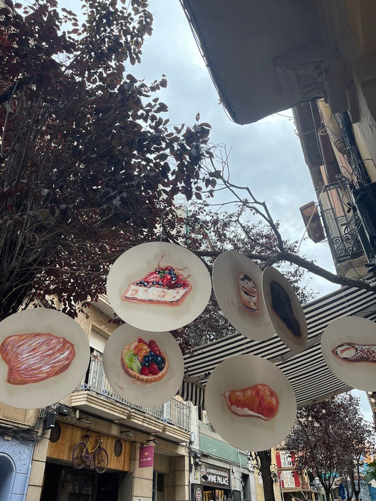 Decoration with pies and sweets in tree's at Festa Major de Gracia in Barcelona.