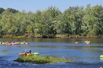 a group of people tubing in the water
